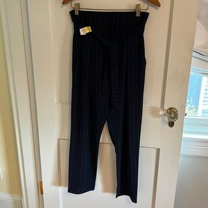 High-waisted dark navy, lightweight trousers with matching belt/tie.